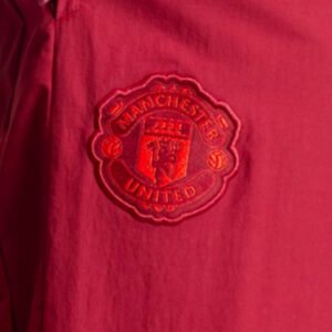 re_1695300179_man-utd-2023-2024-eu-presentation-pants-burgundy-badge