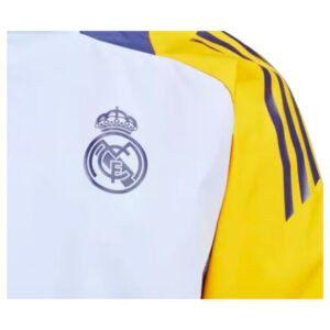 re_1719786293_real-madrid-2024-2025-allweather-football-jacket-glow-blue-badge-1