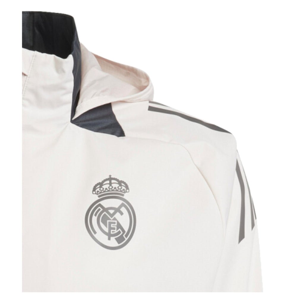 re_1722463515_real-madrid-2024-2025-adidas-eu-allweather-football-jacket-putty-mauve-badge-2